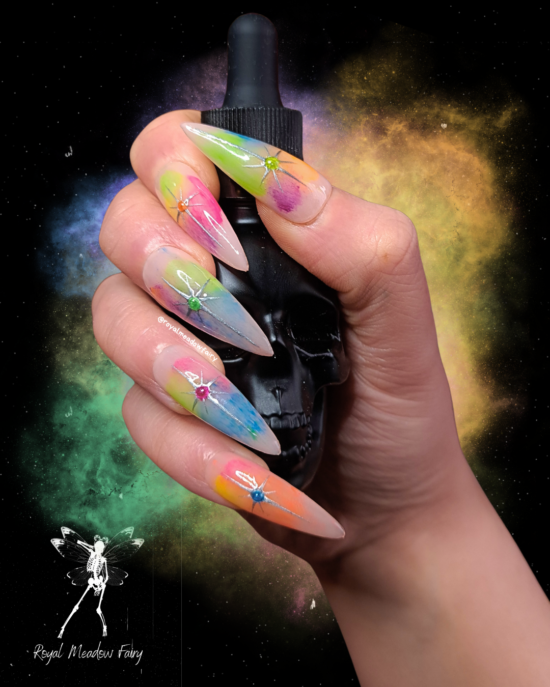 nude press on nails with rainbow powder base and silver star nail art design