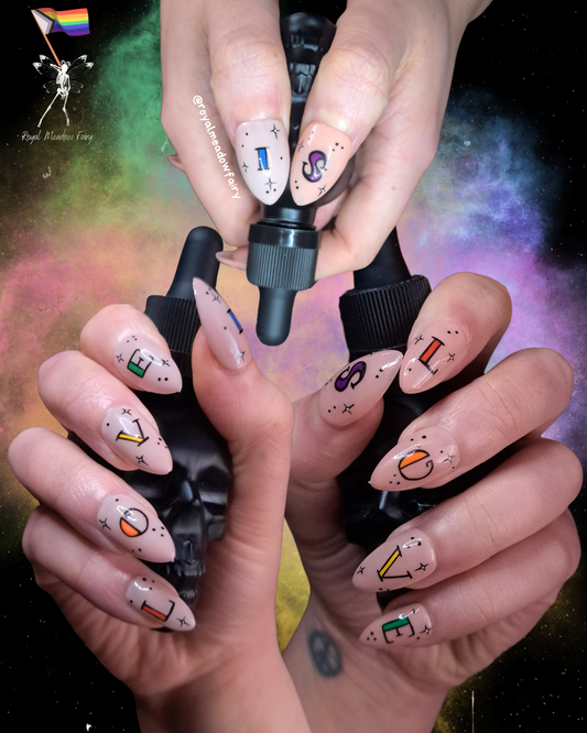 matte nude glue on fake nails with lgbtqia+ nail art love is love
