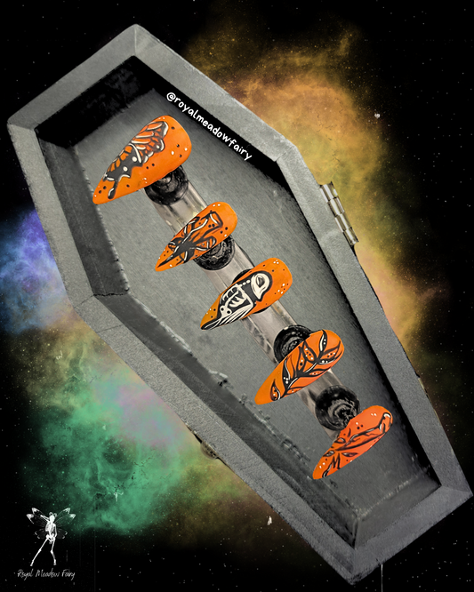 orange press on nails with spooky skeleton halloween nail art design