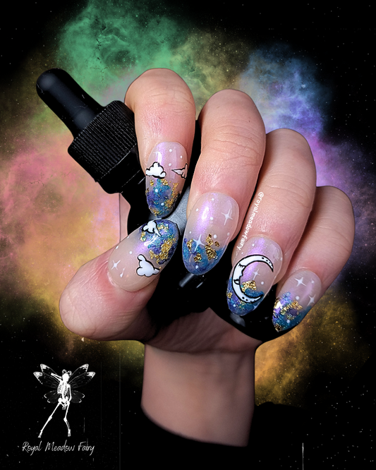 best uk press on nails with iridescent sky, moon and cloud nail art and gold leaf accent