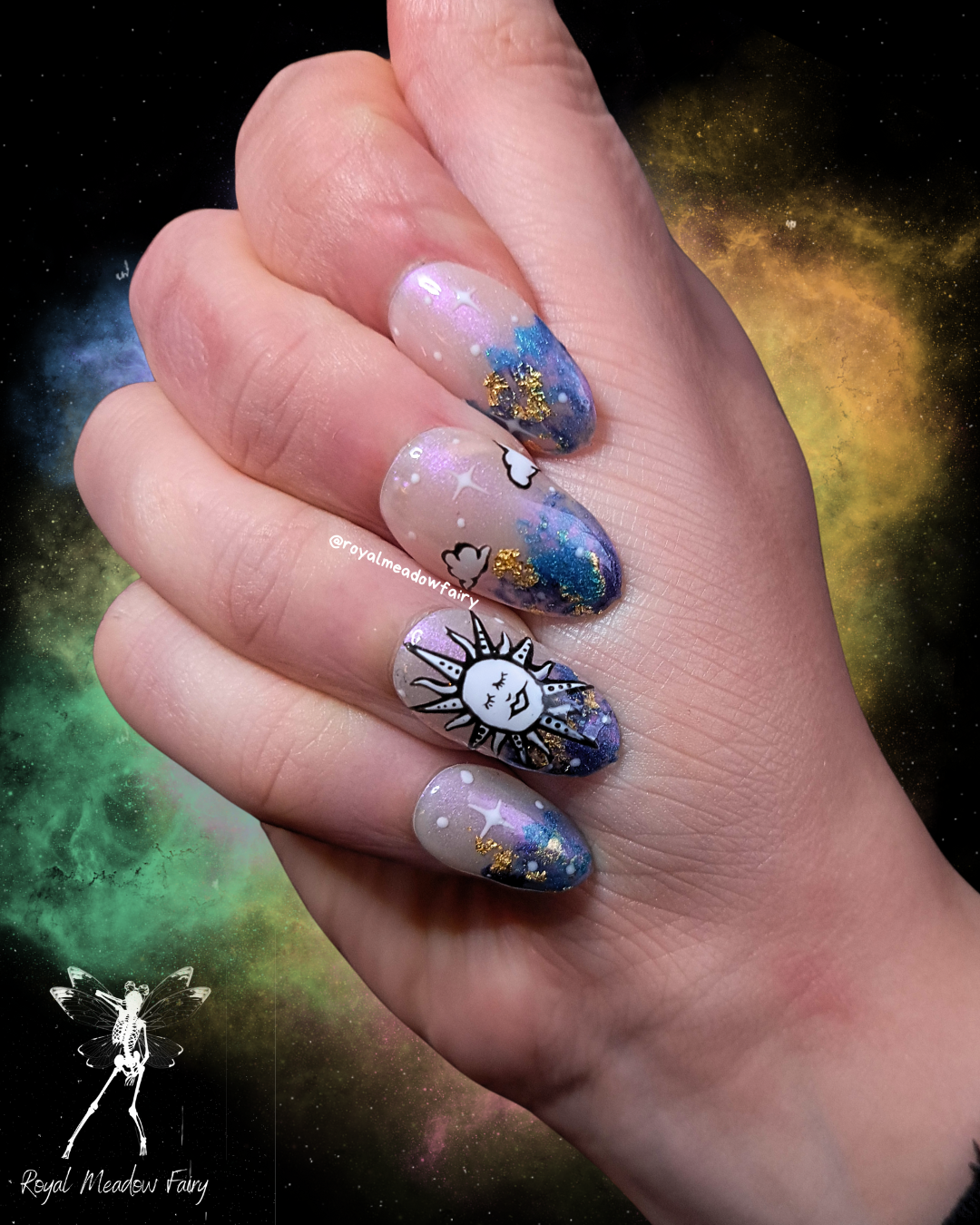 uks best press on nails with shimmer sky and gold leaf and sun and clouds nail art design