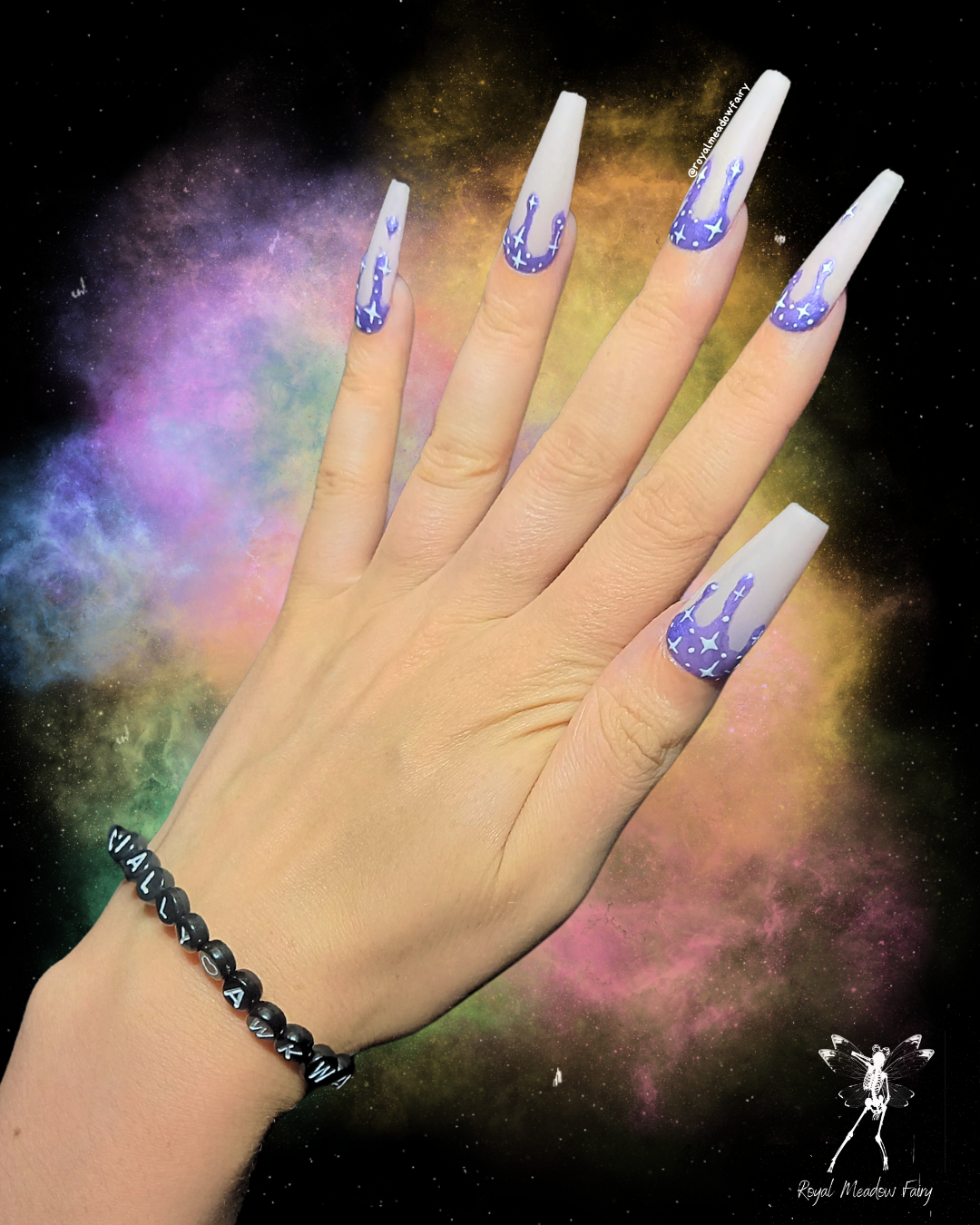 matte pink press on nail extensions with iridescent purple drip and white star nail art