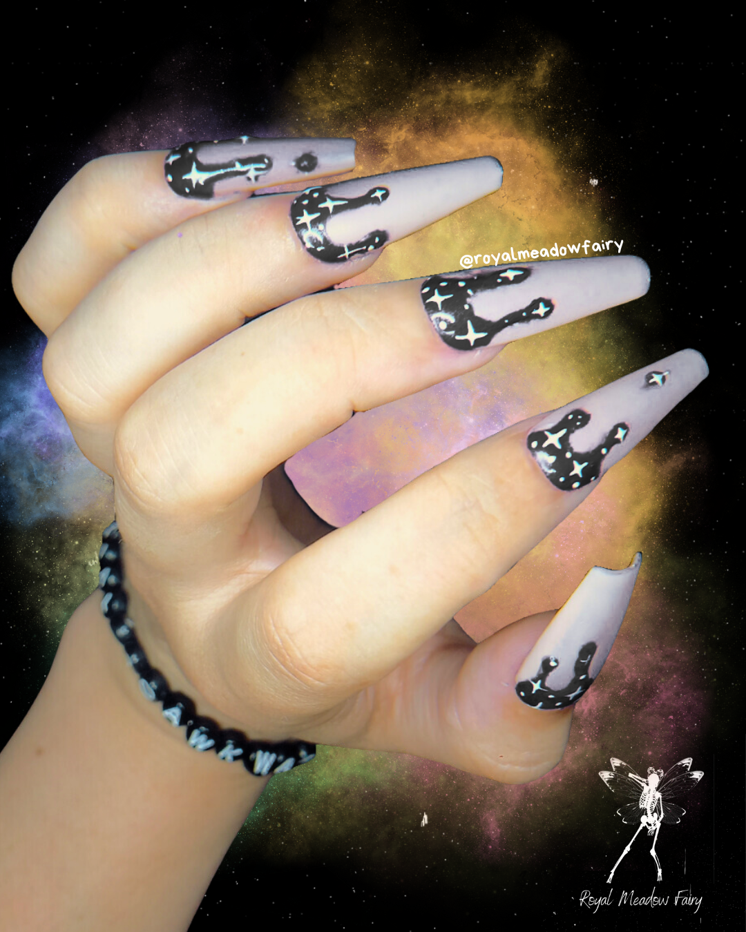 milky white and black drip UK press on nails with white star nail art design