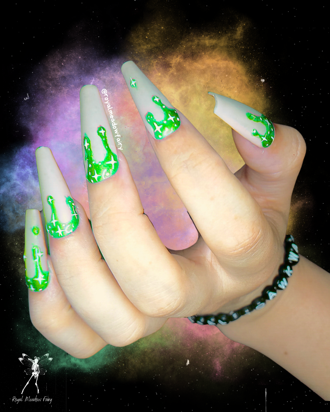 milky white press on nails with lime green drips and stars
