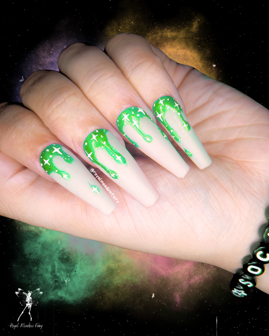 milky white press on nails with lime green drips and stars