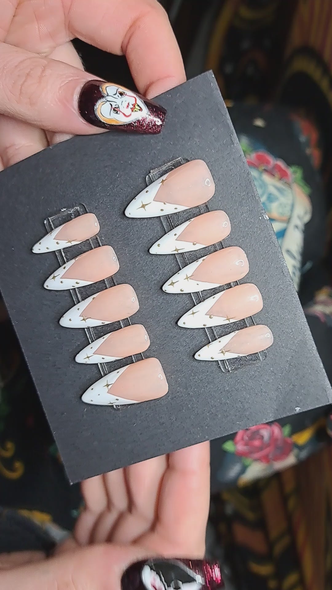 pink and white french nails with gold star nail art design