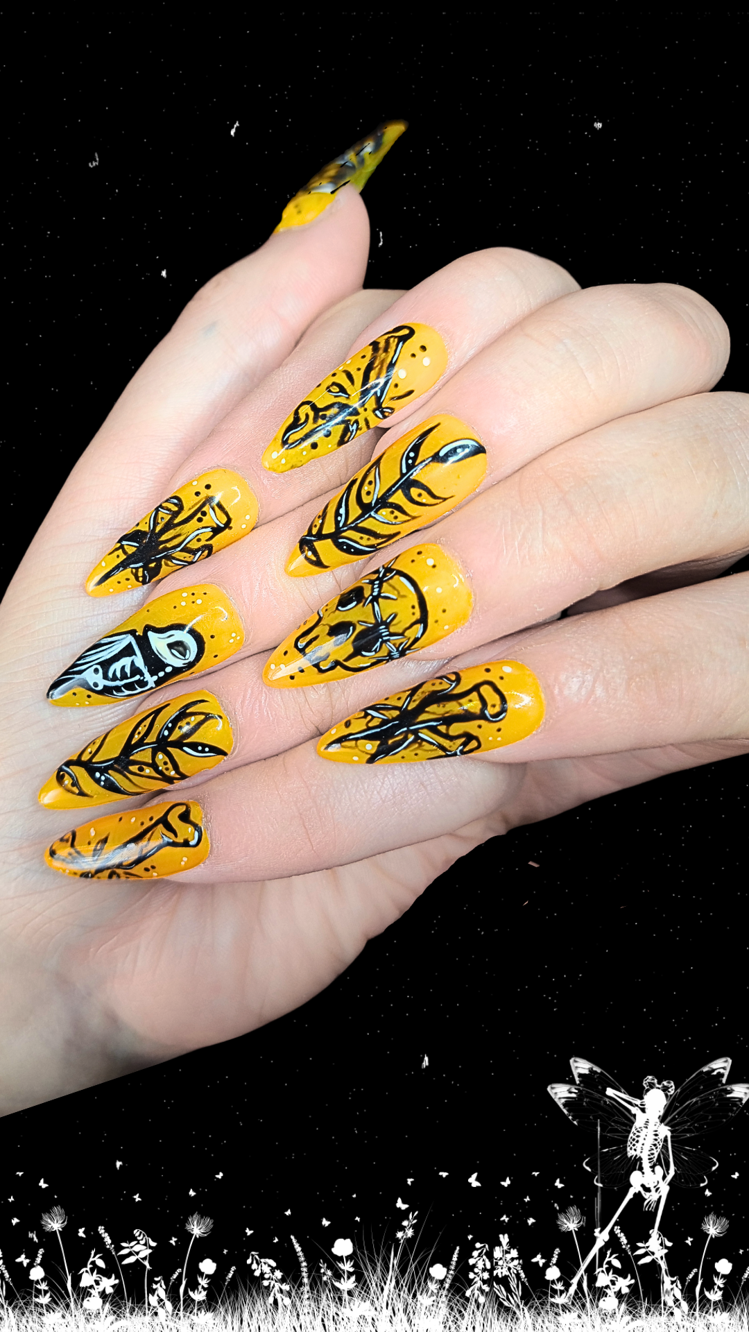 yellow press on nails with blackwork tattoo style nail art design 