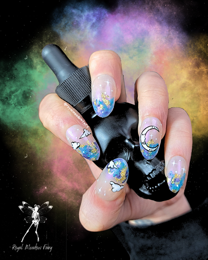 iridescent sky press on nails with gold leaf and white cloud and moon nail art design  