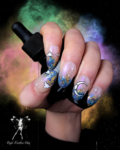 best uk press on nails with iridescent sky, moon and cloud nail art and gold leaf accent  