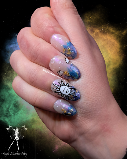 uks best press on nails with shimmer sky and gold leaf and sun and clouds nail art design 