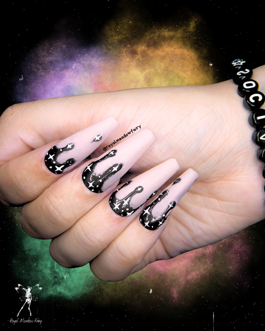 milky white press on nails with black drips and stars UK