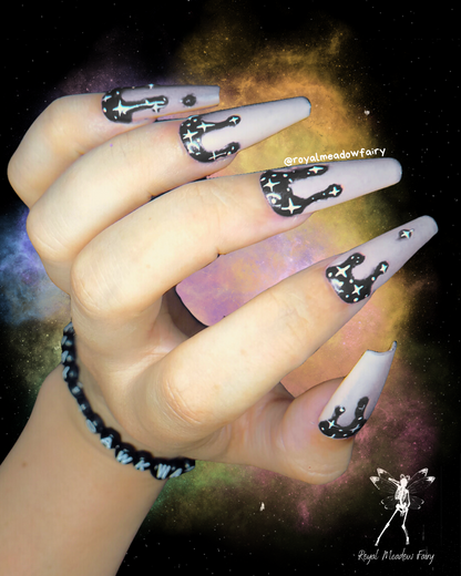 milky white and black drip UK press on nails with white star nail art design 