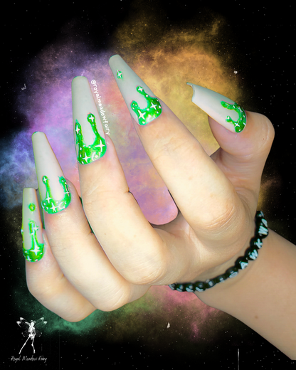 milky white press on nails with lime green drips and stars 