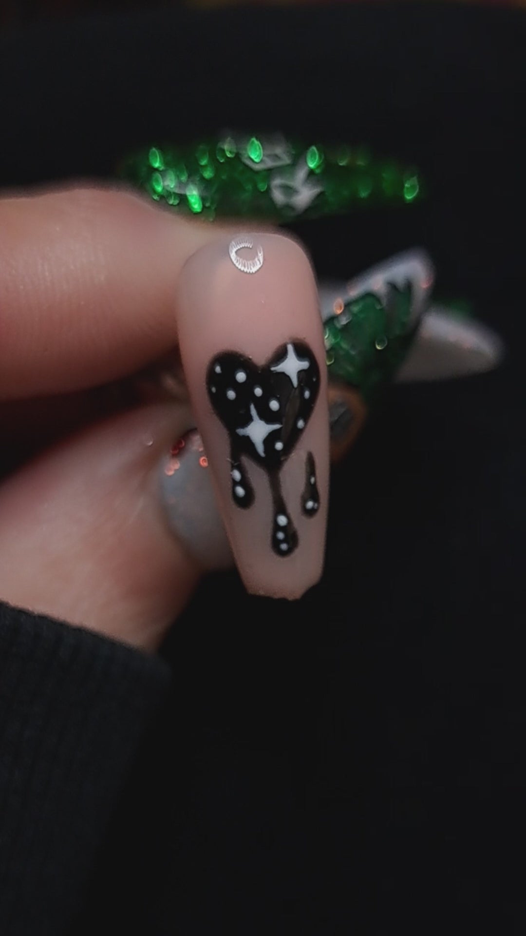 nude press on nails with valentines nail art design of a dripping black heart and stars 