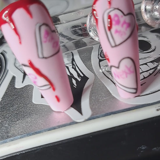 alternative anti valentines press on nails pink with love hearts and vampire mouth with blood drips 