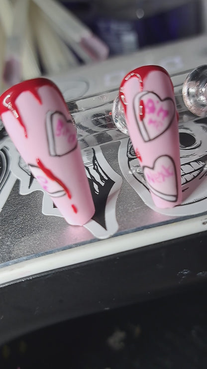 alternative anti valentines press on nails pink with love hearts and vampire mouth with blood drips 